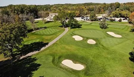 Bird's-eye view of a golf course featuring four sand bunkers.
