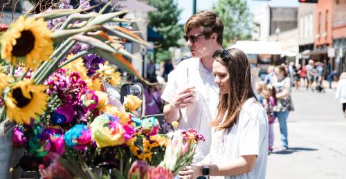 Arts in Bloom couple with flowers