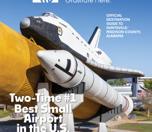 Photo of the space shuttle Explorer at the U.S. Space & Rocket Center on a bright sunny day with clear blue skies.