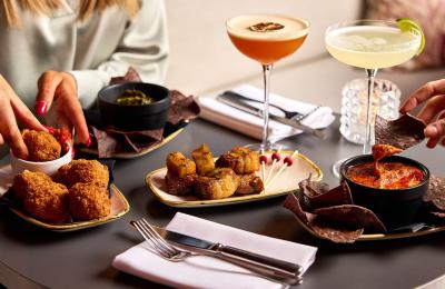 People enjoying small plates and cocktails at Rick's Bristol