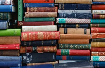 A stock image of books stacked on a shelf