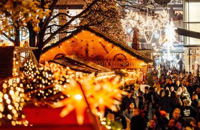 Christmas lights and stalls with Cabot in background - Credit James Bridle