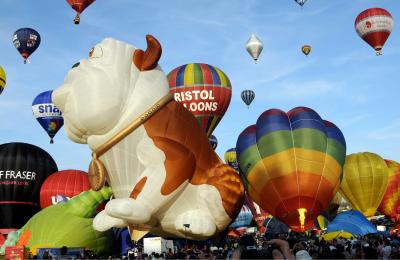 A group of balloons lifting off in a mass ascent at Bristol International Balloon Fiesta - credit Andrew Varcoe