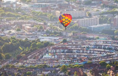 A balloon from the Bristol International Balloon Fiesta flying over the Totterdown area of the city - credit Paul Box