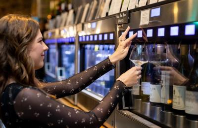 Woman choosing wine from Enomatic machine at Le Vignoble Bristol - credit Le Vignoble