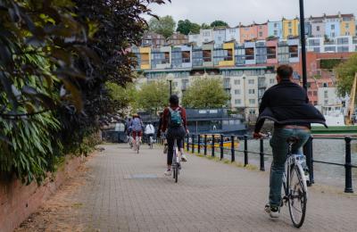 A group of cyclists riding along the Harbourside Loop path in central Bristol - credit Cycle the City