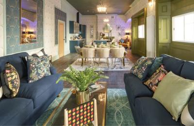 A lounge area with 2 grey sofas and a table - credit Mint Stays