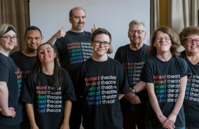 A group of people wearing black t-shirts that say Firebird Theatre Company