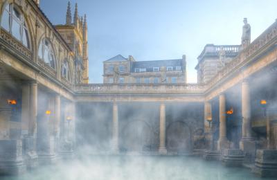 An wide shot of the Great Bath at The Roman Baths in central Bath, near Bristol
