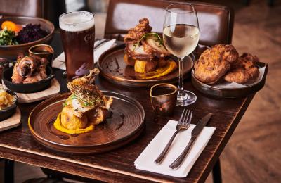 A selection of Sunday roasts on a table at The Maple restaurant in Cleeve, near Bristol - credit The Maple