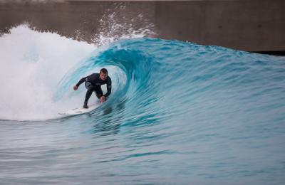 A surfer riding a wave at The Wave inland surfing lake near Bristol - credit The Wave