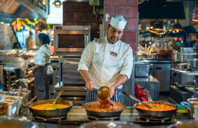 Indian stall at Za Za Bazaar. Indian chef cooking up halal dishes during a demo.