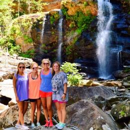 Women in front of waterfall
