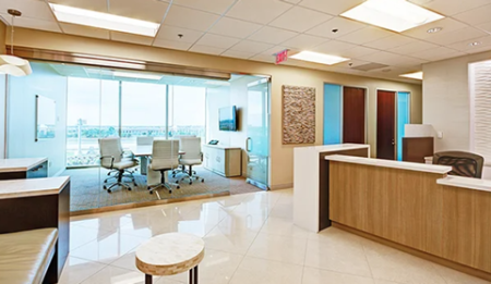 Premier Offices - open lobby with glass conference space and reception desk