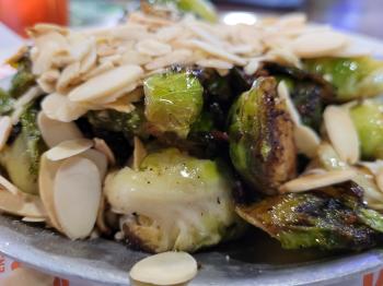 Close up of Brussels Sprouts with Bacon and Almonds from Twisted Fork Restaurant in Port Charlotte, Florida