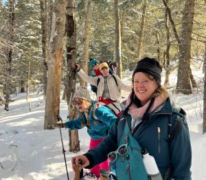 Members of the Visit Albuquerque staff look happy on a snowshoe tour