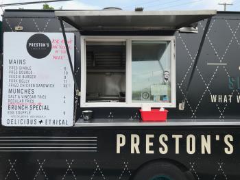 View of the menu and order window of Preston's Burger Food Truck