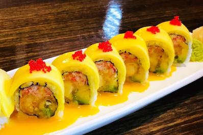 sushi with mango on top