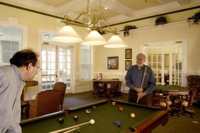 Men playing pool at Country Lane