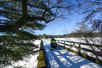 Snowmobile crossing the Bearskin Trestle Bridge