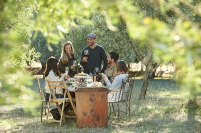 People drinking and eating in nature outdoors at Olio Bello Margaret River Cowaramup