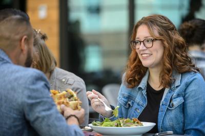 People eating food at Crave Restaurant