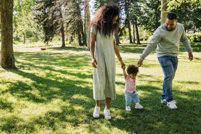 Family walking through park