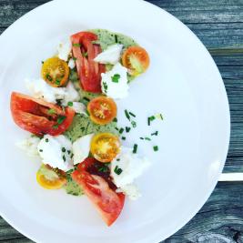 Heirloom tomatoes burrata cheese blue crab and Green Goddess Dressing from LOLA in Covington