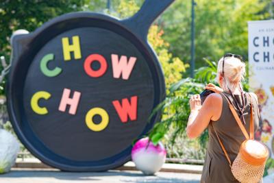 A woman takes a picture at the Chow Chow culinary celebration in Asheville, NC