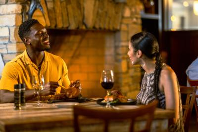 Couple eating at Winesett House in Punta Gorda, a Best of Florida Seafood Restaurant honoree, on an October evening.