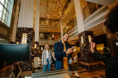 Man and woman checking in to Hotel LeVeque