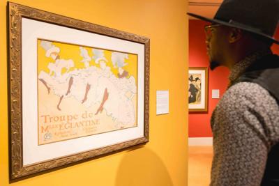 Man looking at Toulouse Lautrec portrait