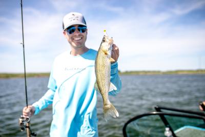 man holding walleye on Devils Lake ND