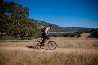 Man riding his bike on a trail at Harvey Bear Park