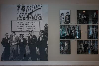 Photos on wall at Hotel Legends showing images of famous visitors over the year.