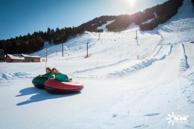 Snow King two kids tubing