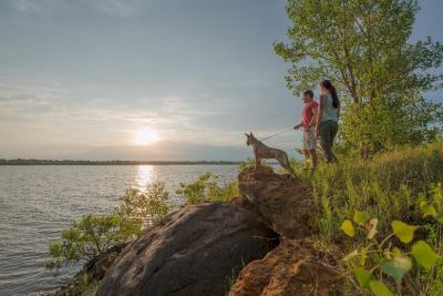 Couple with dog overlooking the lake at Kanopolis State Park