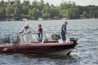 kids fishing in boat