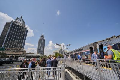 People boarding the Mardi Gras Service in Mobile