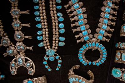 Squash blossom turquoise necklaces were worn by both men and women.