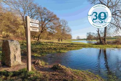 View of the source of the Thames and signpost for Thames Path