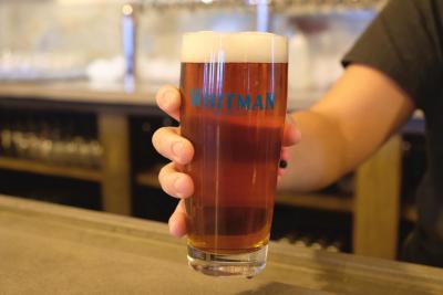 glass of beer being held