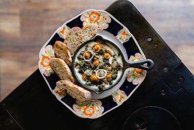 Plate of bread and a dip on a table