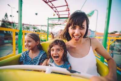 family riding roller coaster