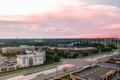 Aerial photo of Topgolf, hotels and other businesses at sunset.