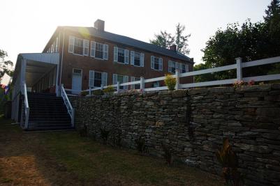 A stone terrace leads to the main entrance of Ironmaster's Mansion in Pine Grove Furnace State Park.