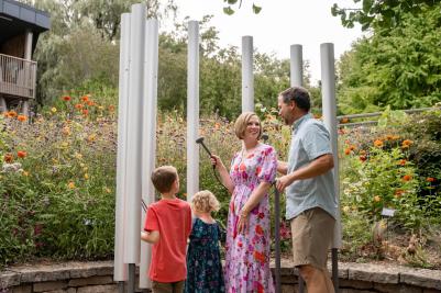 Family at an interactive exhibit at the Botanical Garden in Green Bay Wisconsin