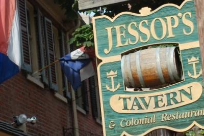The exterior of Jessop's Tavern with a focus on their front sign.