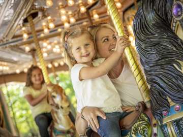 Little girl on carousel