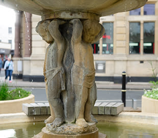 View of the fountain statues at Boots Corner